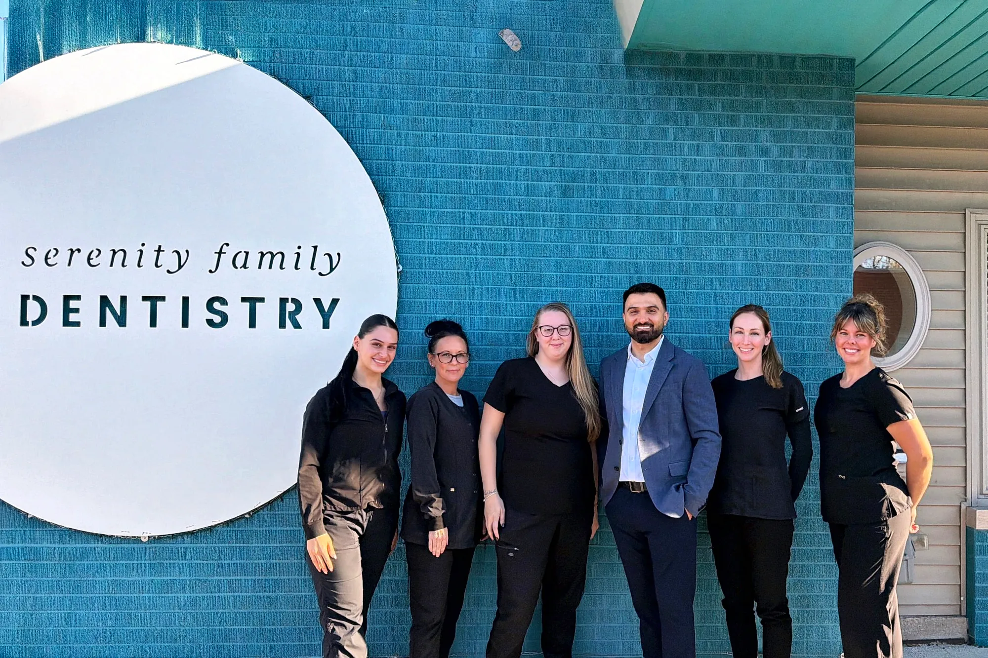The Serenity Family Dentistry team outside the office on Crooks Road